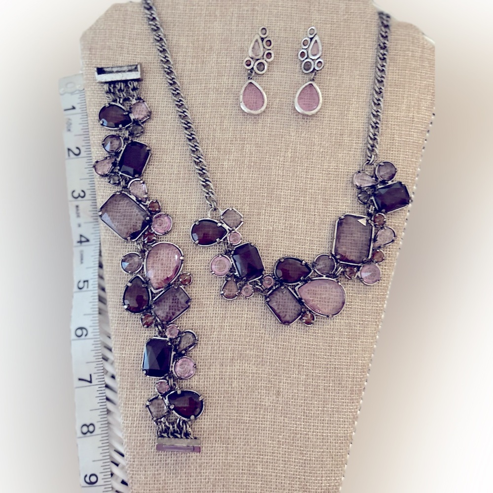 Lavender stones. Unique setting of 3. Will break up the set